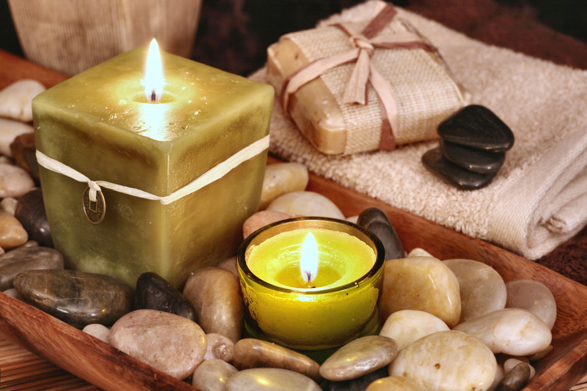 Spa Tranquility with stones, candles, soap in neutral tones